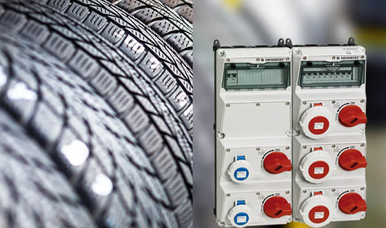 a light yellow AMAXX combination unit in front of a close-up of a car tire