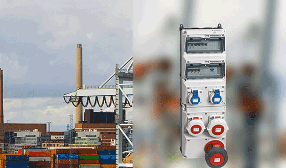 a light gray AMAXX combination unit, in the background you can see a part of a container port